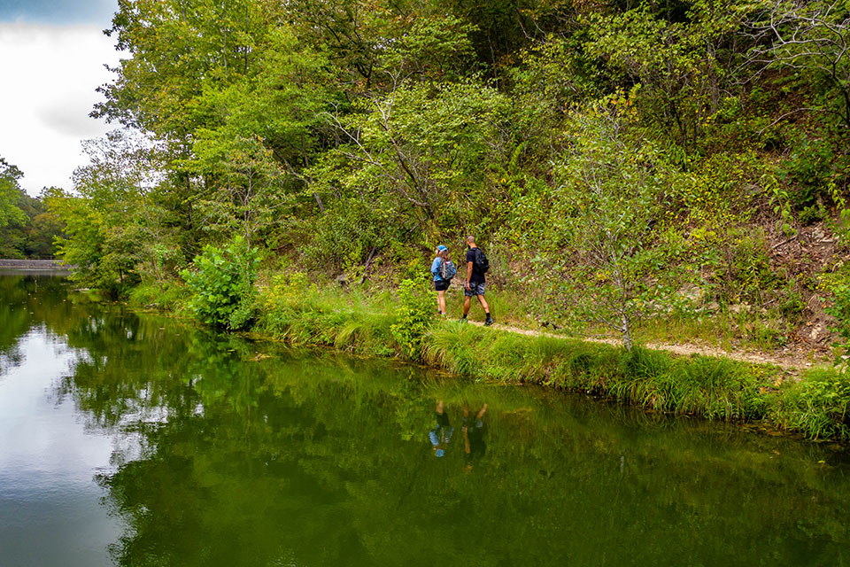 Hiking couple on lake trail rear view-Website Resized